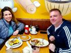 Couple enjoying breakfast at Tasty Waffle Restaurant in Romeoville Couple enjoying breakfast at Tasty Waffle Restaurant in Romeoville