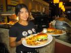 Friendly server with burgers at Xando Cafe in Hickory Hills Friendly server with burgers at Xando Cafe in Hickory Hills