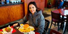 Customer enjoying lunch at Brandy's Gyros in Chicago Customer enjoying lunch at Brandy's Gyros in Chicago