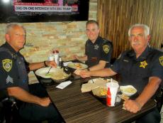 Police officers enjoying lunch at Dengeos Restaurant in Skokie Police officers enjoying lunch at Dengeos Restaurant in Skokie