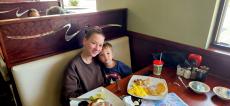 Mother and son enjoying breakfast at Maple Butter Cafe in Plainfield