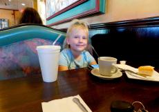 Young customer enjoying soup at Rose Garden Cafe in Elk Grove Village