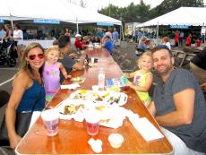 Family enjoying the St. Nectarios Greek Fest in Palatine